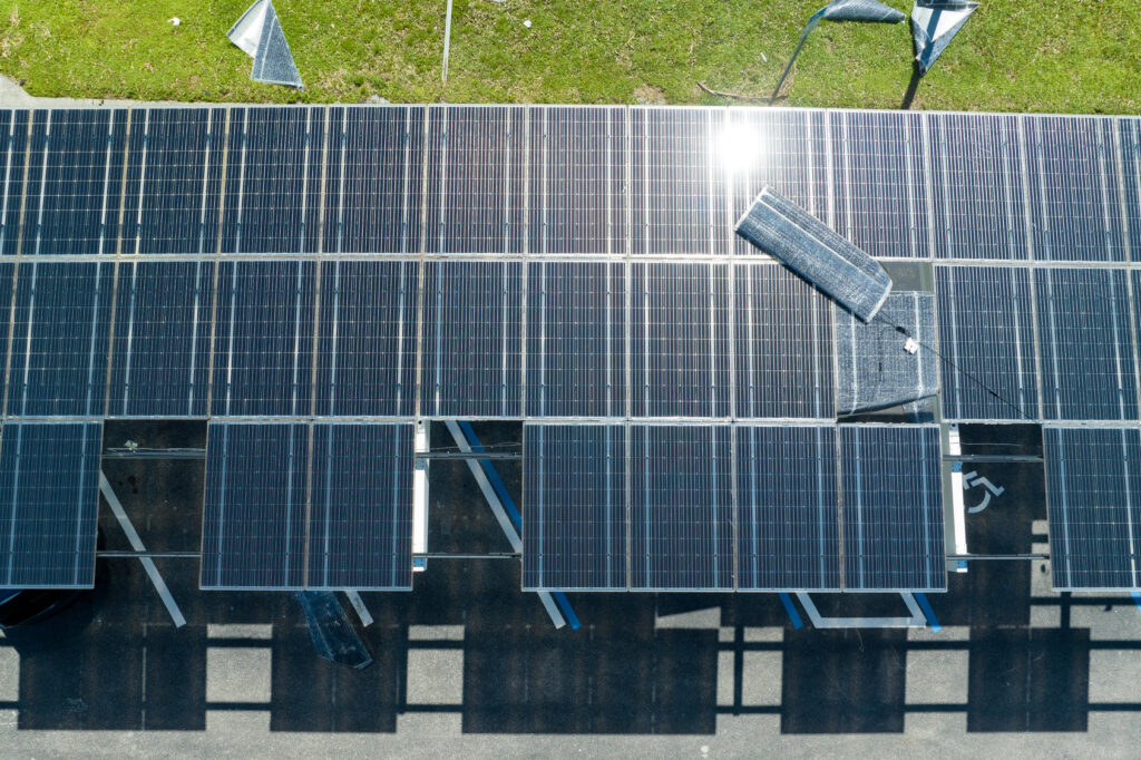 Displaced solar panels on a parking canopy viewed from above